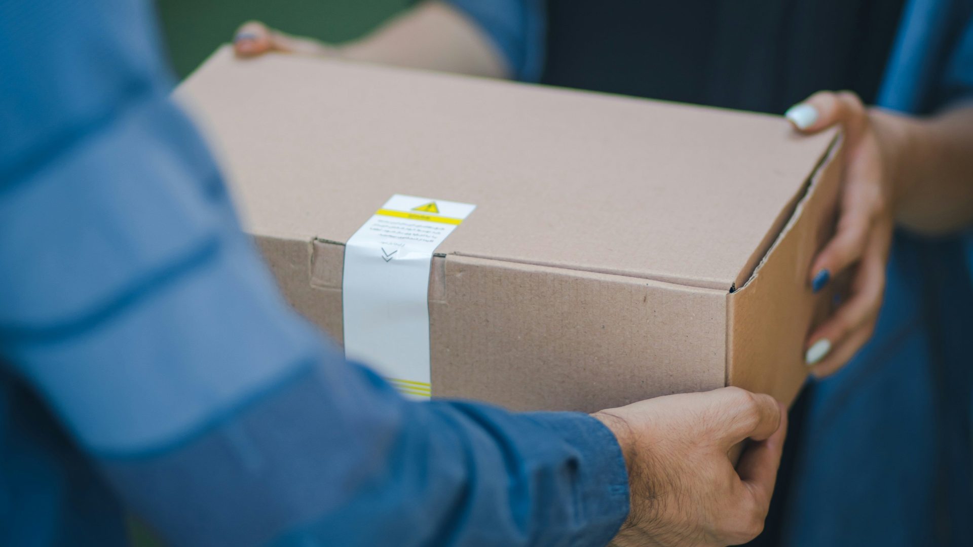 person giving brown box